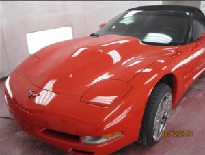 New red corvette with modified hood and work on the hood